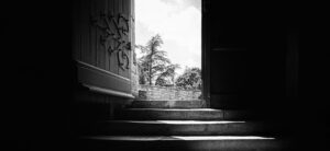 An open interior door with light visible beyond.